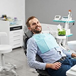 Male patient with dental implants in Grapevine, TX smiling in dental chair