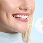 a person with a dental implant smiling