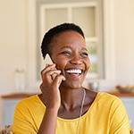 Woman smiling while talking on phone