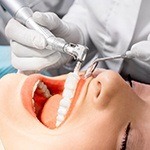 Woman receiving teeth cleaning