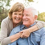 happy elderly couple in nature 