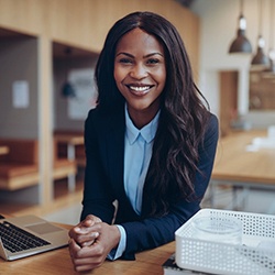 Woman smiling after periodontal therapy