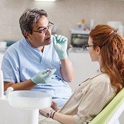 Dentist talking to patient about Invisalign treatment