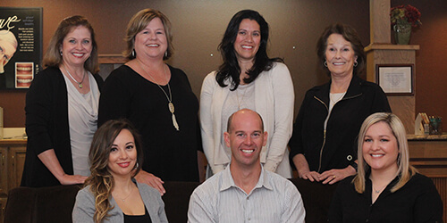 the dental team at Smiles by Martin smiling together