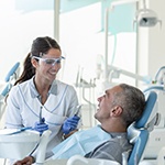 Dentist smiling at patient during appointment