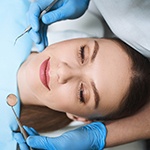 Relaxed woman in dentist’s treatment chair