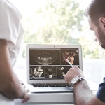 Dental professionals examining dental scan results on computer