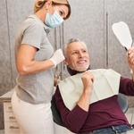 man talking to dentist about cost of veneers in Grapevine 