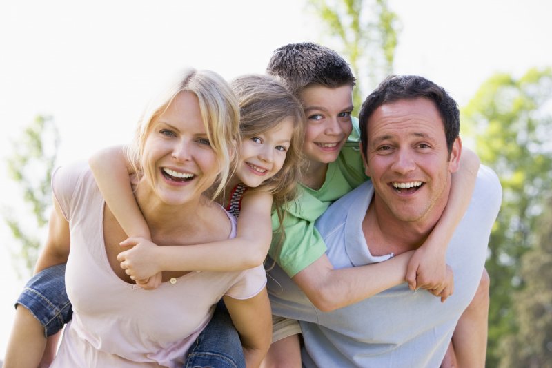 A smiling family visiting a dentist in Grapevine.