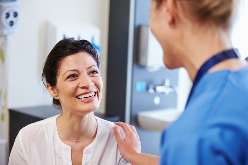 Dentist explaining cost of dental implants in Grapevine to patient