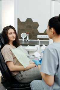 Woman at consultation with cosmetic dentist